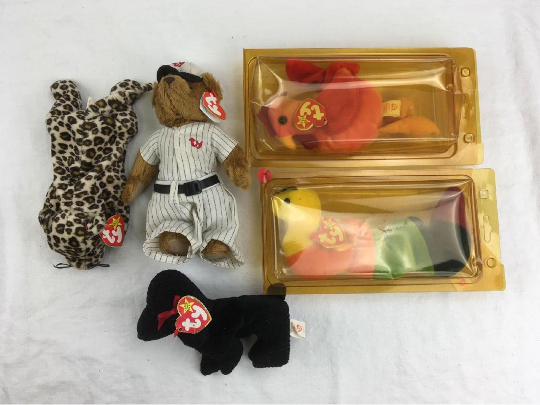 Lot of 5 Vintage Beanie Babies: Lot of 5 Vintage Beanie Babies this lot includes 1) Inch,tag reads "1995", 2) Strut, tag reads "1996", 3) Gigi, tag reads "1998", 4) Cooper, tag reads "2000", and 5) Freckles, tag is marked 1996. All 