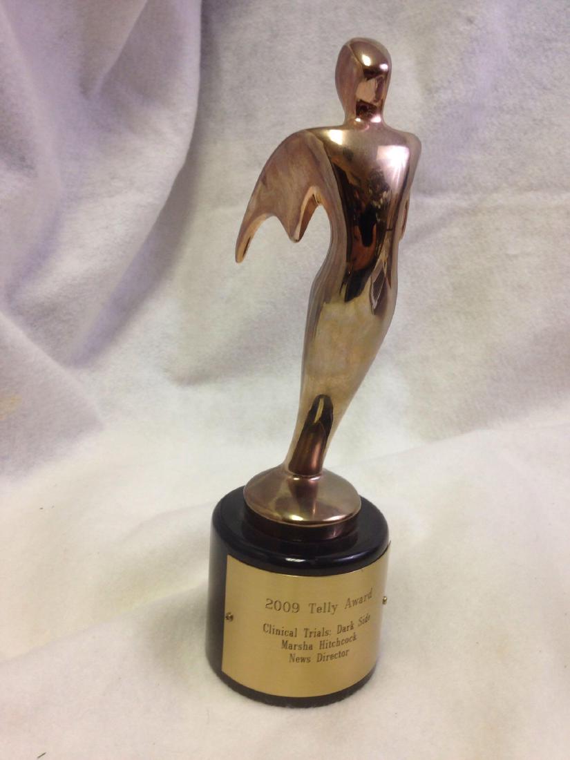 2009 Telly Award: The Telly Awards honor excellence in video and television across all screens. This was presented to Marsha Hitchcock for "Clinical Trials: Dark Side"which aired on the Ivanhoe Broadcast News.The award
