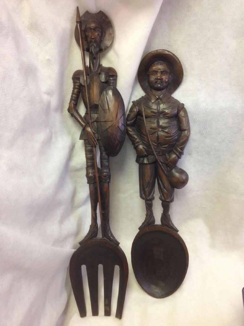 Wooden Don Quixote and Sancho Panza Fork and Spoon: Need and a nice display for the Galley? If so look here. This is a nice hand carved wood Fork and Spoon. One show Don Quixote up top. The other his friend Sancho Panza. Size: 38" x 7" each. Color: sta