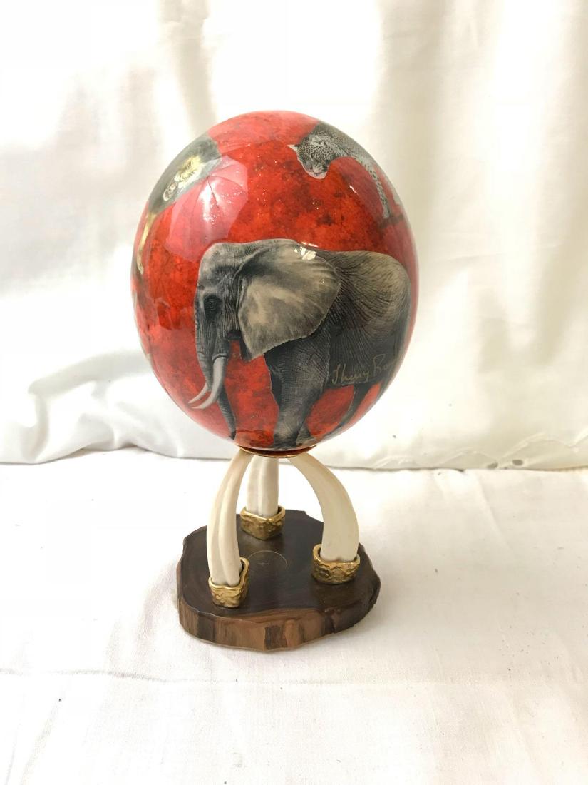 Genuine Shelly Rowe Zulu Tribe Ostrich Egg: Hand painted Zulu African Ostrich egg. Shelly Rowe is an artist who creates the designs for these collectible eggs, then hands them off for hand painting by a member of the Zulu Nation in Africa