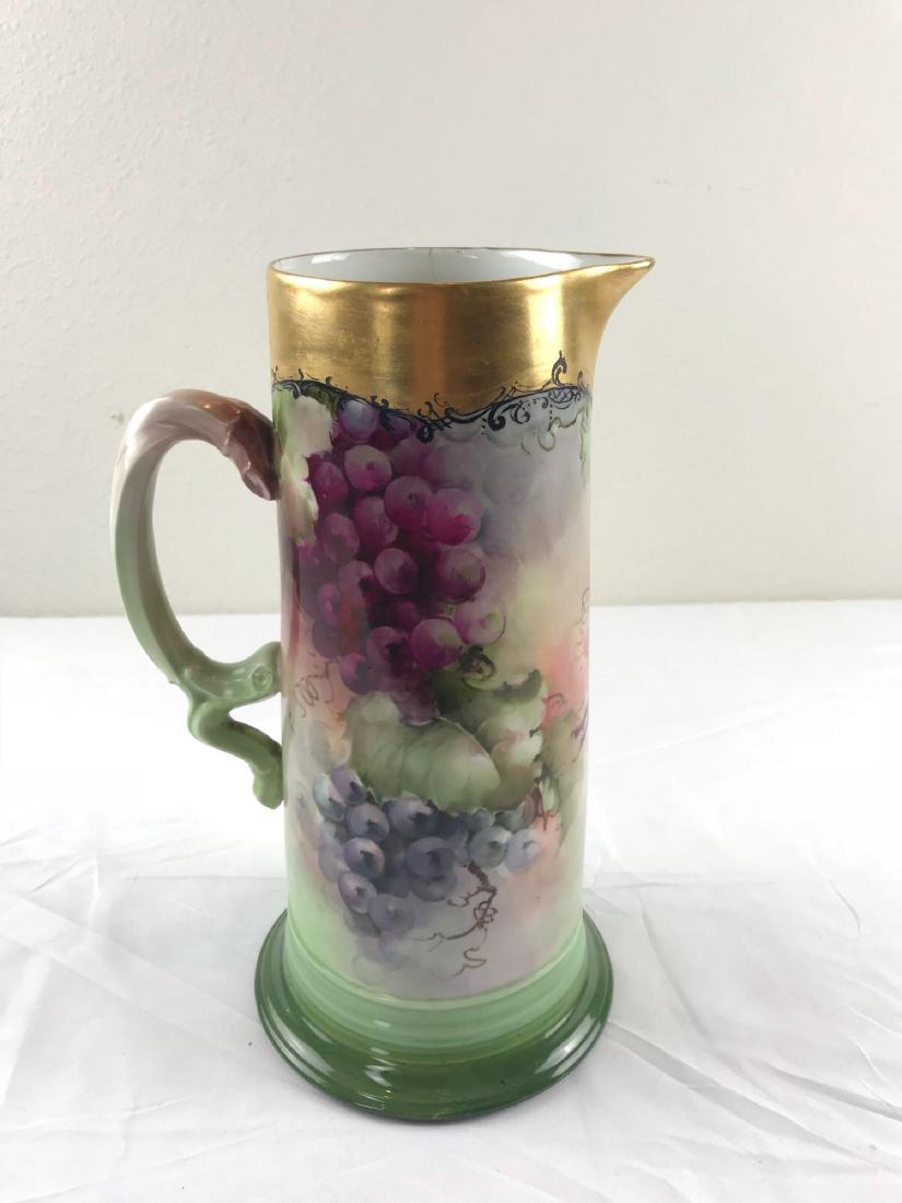 Jean Pouyat Limoges Pitcher JPL France 559: PouyatÂ LimogeÂ #559 pitcher, hand painted and made in France. Signed A. Robinson. 12" H, 4" diameter mouth, 6" footprint. Item has a 2" vertical at the rim.