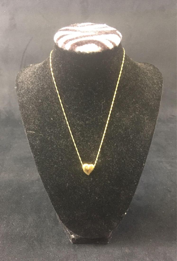 Vintage 10K Gold Pendant Necklace: Vintage 10K Gold Pendant Necklace; This lovely piece is made in Italy and is double marked 10k gold and .417. The chain measures at approximately 16" L and the pendant at 1/4" L x 1/2" W and weighs 1.