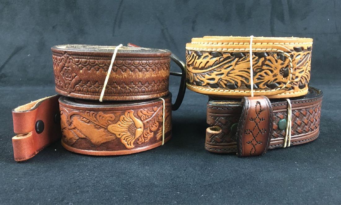 Lot of 4 Hand Tooled Leather Belts: Lot of 4 Hand Tooled Leather Belts; 1) 44" L, dark brown showing geometric pattern, in good condition showing some wear of finish and buckle marks, 2) 36" L, dark brown showing a weave pattern and mar