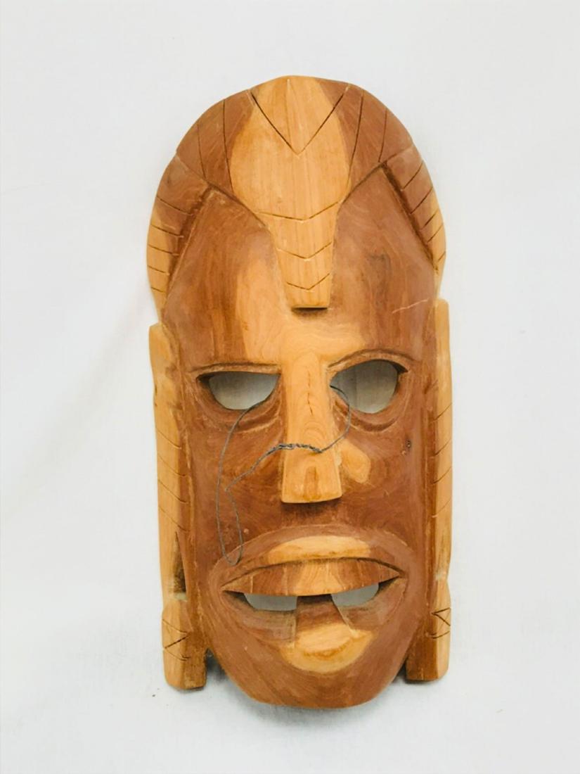 Hand Carved Tiki God Polynesian Art: This hand-carved tiki mask resembles popular Totem and Tiki culture that is mainly associated with ancient Polynesian craftsmanship and symbolism. It's approximate measurements are 14.75" tall by 7.75