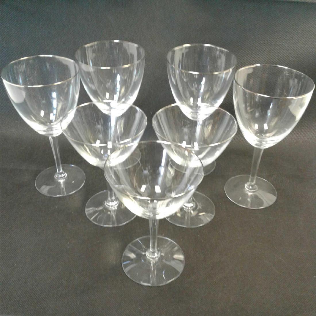 7 Fluted Wine Glasses, Platinum Rimmed: 7 Fluted Wine Glasses, Platinum Rimmed; in this lot there are 4 fluted white wine glasses and 3 fluted champagne saucers. They are clear and bright, each is in excellent condition. Each white wine gla