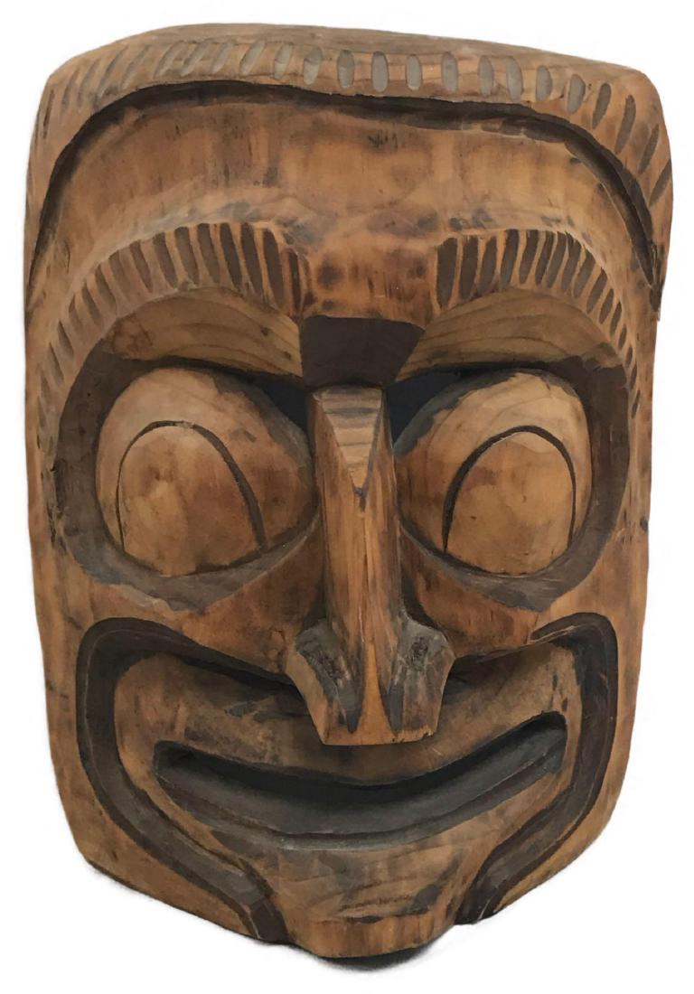 Vintage Smiling Tiki Mask: Vintage Smiling Tiki Mask- This hand-carved tiki mask resembles popular Totem and Tiki culture that is mainly associated with ancient Polynesian craftsmanship and symbolism. It's approximate measureme