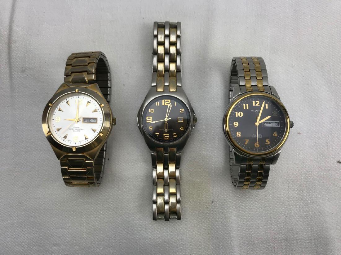 Lot of 3 Men's Watches: Lot of 3 Men's Watches; this includes 2 watches marked Puritan and 1 marked Timex Indiglo. All are marked "water resistance". The Puritans are marked Quartz movement. The Timex is in excellent conditi