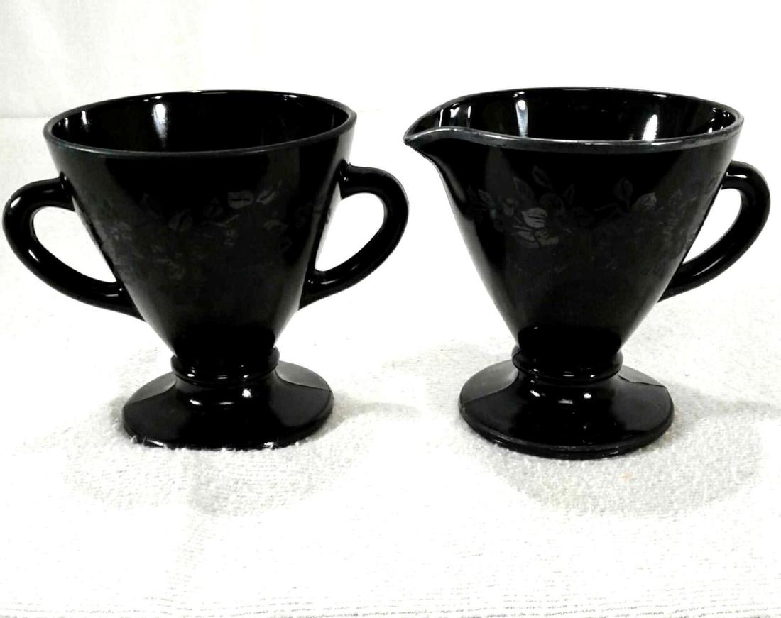 2 1930â€™s Hazel-Atlas Black Ovide Sugar Bowl and: Here is aÂ double handle sugar bowl and creamer. They were produced by the Hazel-Atlas Glass Company circa 1930-1935. These are black Ovide with the premium sterling silver floral overlay. The silv