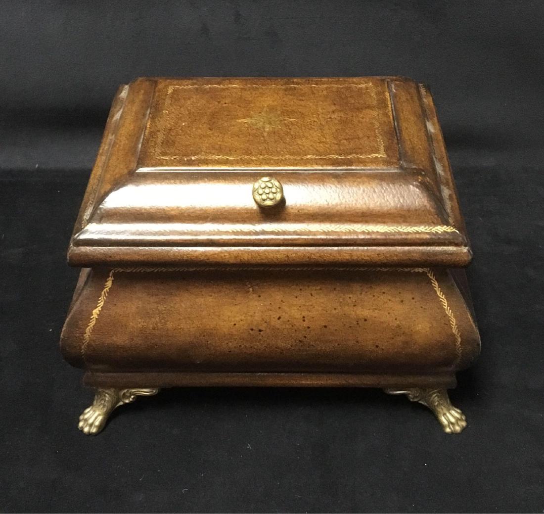 Vintage Man's Jewelry Box on Brass Feet: Vintage Man's Jewelry Box on Brass Feet; a large substantial jewelry box showing a compass rose on the lid. The finish gives a leather appearance, the hardware is brass. It holds a singleÂ compartme
