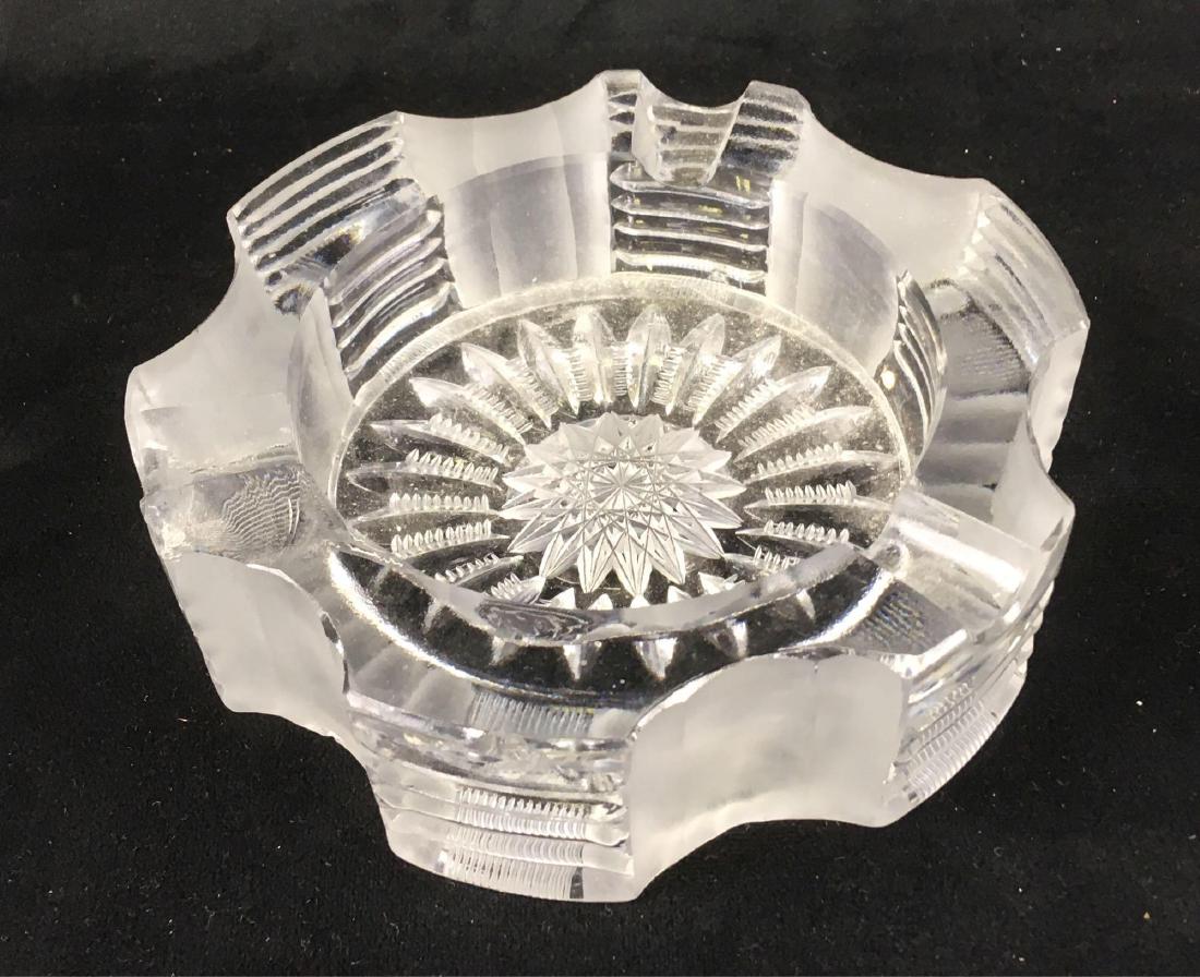 Vintage Heavy Cut Glass Ash Tray: Vintage Heavy Cut Glass Ash Tray; a high quality piece, very substantial. The cuts are clean and sharp. The condition is fair as there are two chips on the top rim. The ashtray measures 1 3/4" H x 6" 