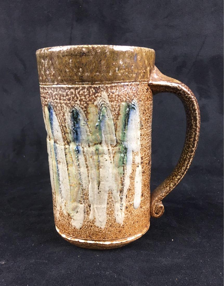 Large Earthenware Handmade Mug, Signed: Large Earthenware Handmade Mug, Signed; a substantial piece with strong bold glaze. It is in excellent condition and measures 3 1/2" W x 5" D (w/handle) x 6 1/2" H.