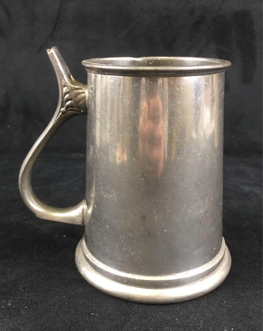 Vintage Pewter Whistle Mug Marked William Adams: Vintage Pewter Whistle Mug Marked William Adams; this mug shows a glass bottom with a whistle cast into the top of the handle. It is marked "Sheffield England".Â The mug measures 4: W x 5 1/2" D (w