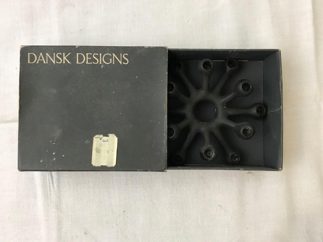 Vintage Dansk Designs Small Taper Holder: Vintage Dansk Designs Small Taper Holder; Made of cast iron and holds a total of 12 small tapers. The candle holes measure at approximately 1/4" and the holder itself at 1" H x 4" D.