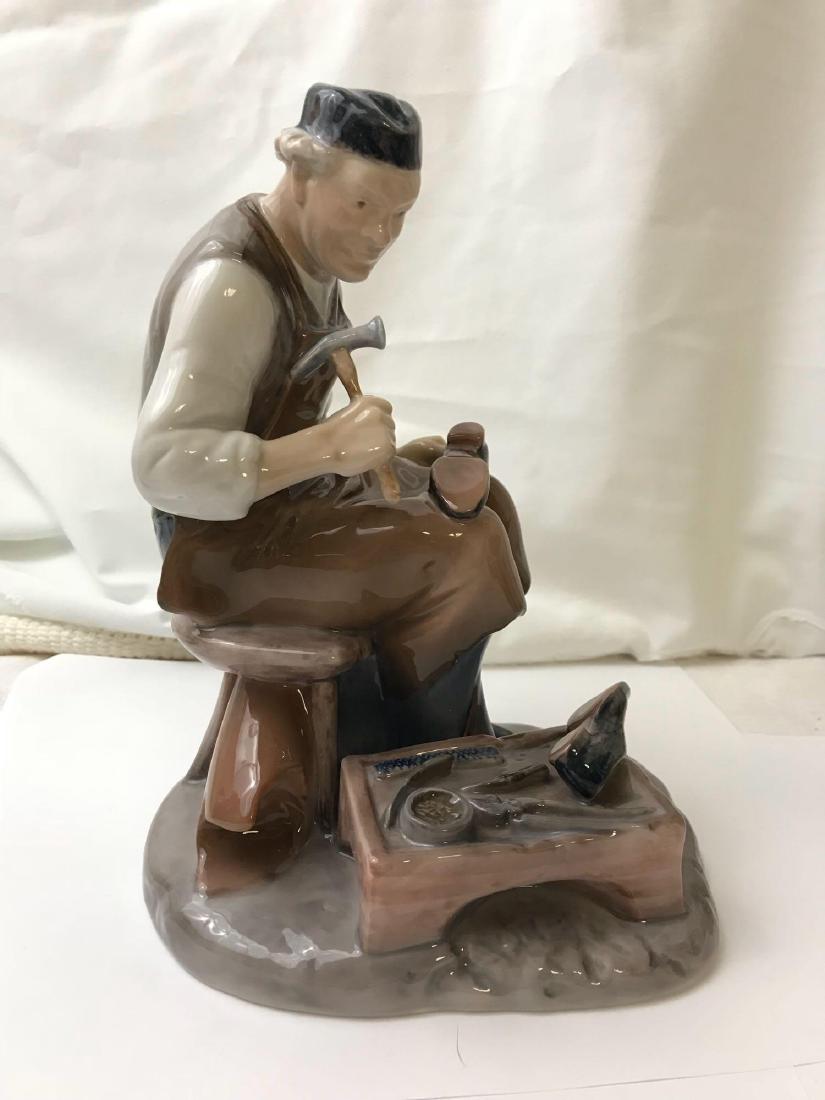 Royal Copenhagen Shoemaker At Work Porcelain Figurine;: Royal Copenhagen Shoemaker At Work Porcelain Figurine; Royal Copenhagen Shoemaker At Work Porcelain Figurine; Bing and Grhondal realism figurine. In excellent condition with no chipping or scratching.