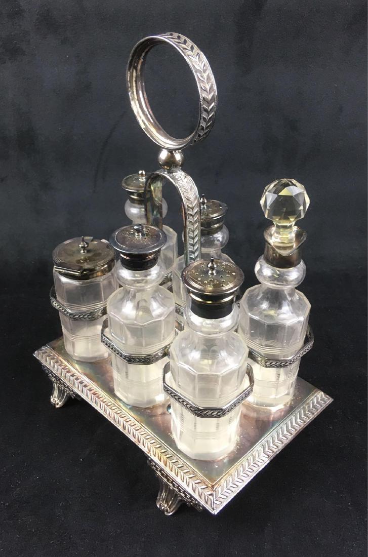 Antique Deykin And Harrison 6 Piece Silver Plate Cruet: Antique 6 Piece Silver Plate Cruet Set; This set includes complete with 4 identical shakers, an oil dispenser, and a condiment jar that come with a silver plated, footed caddy. The bottom of the caddy