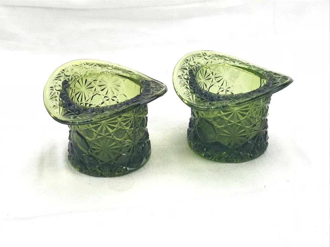 Green top hat fenton: Here are 2 large daisy button top hat; measuring 4 1/2" across the brim and 3 1/4" tall. Condition is very good with a small chip on the edge of each brim. Sides have large daisy & buttons and bottom 