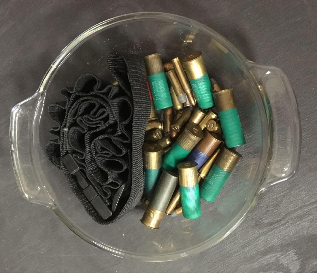Ammo Lot Shotgun Rifle Pistol: MiscellaneousÂ ammunition lot, 38 Special, 45 acp, .556, 20 gauge, etc. 34 pieces in all, plus shotgun shell belt. Glass bowl for display only.
