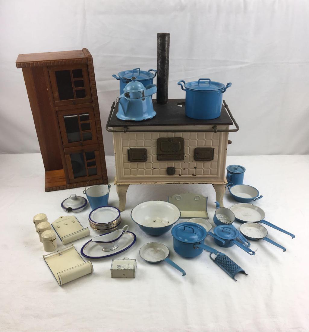 Vintage Tinplate Cast Iron Toy Stove: A complete kitchen for your antique dolls or dollhouse collection. We have been unable to pinpoint the manufacturer of this set, but one plate has a mark, a lion stand on a kettle pot with a large B i