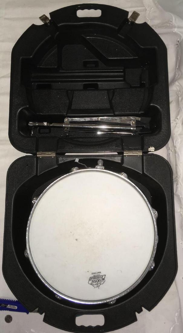 Ludwig Rockers Snare Drum: Ludwig Rockers Snare Drum; Includes stand and case. The drum measures at approximately 6" H x 14" D. Drum has some condition issues.