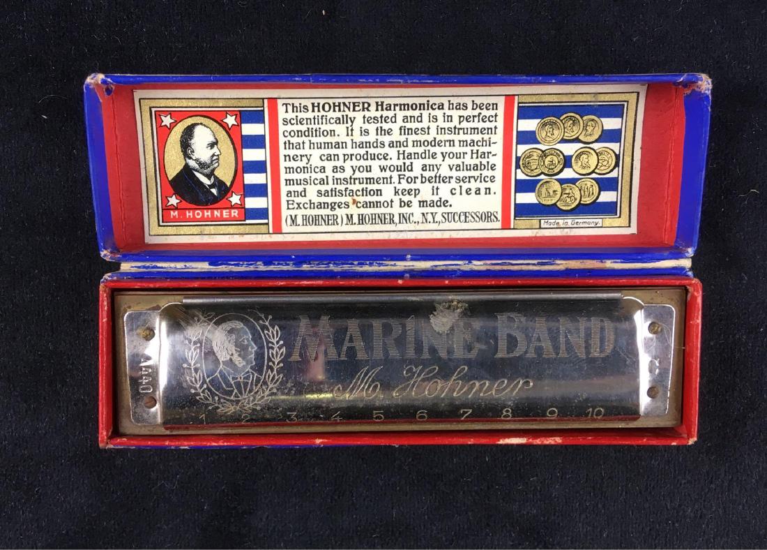 Antique Marine Band M Hohner Harmonica: Antique Marine Band M Hohner Harmonica; In key C and includes original box. Both the metal on the harmonica and box have some wear due to age, but are overall in good condition. The harmonica measures