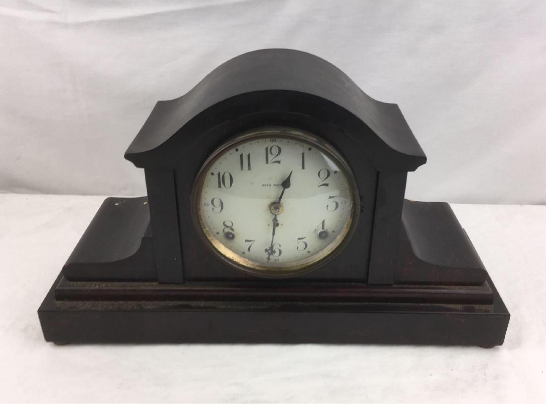 Seth Thomas Adamantine Mantle Clock: Seth Thomas Adamantine Mantle Clock; 89 AL project clock. Includes key and pendulum and it still winds and runs. There is a minor chip in the wood on back area of the clock, please review photos for d