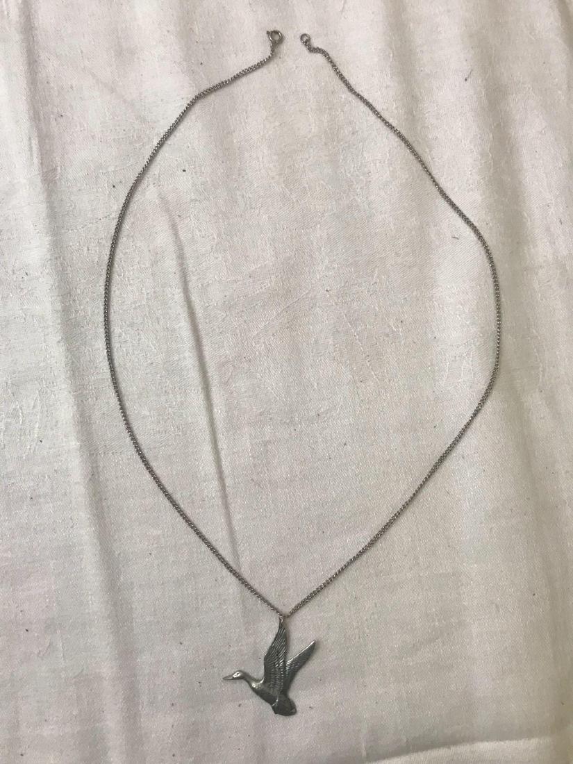 Vintage Goose Pendant Necklace: Vintage Goose Pendant Necklace; With the engraving " L.C.P. Jim MauhÂ Charleston North Carolina". The pendant measures at 1 1/2" L x 1 1/2" W and the chain measures 24" L.