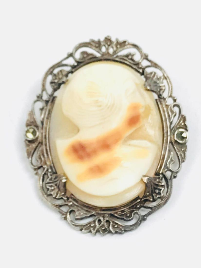 Vintage Sterling Silver & Sea Shell Cameo Brooch: Vintage Sterling Silver & Sea Shell Cameo Brooch; Lovely marked sterling piece. Measures at approximately 1 1/2" L x 1 1/4" W.