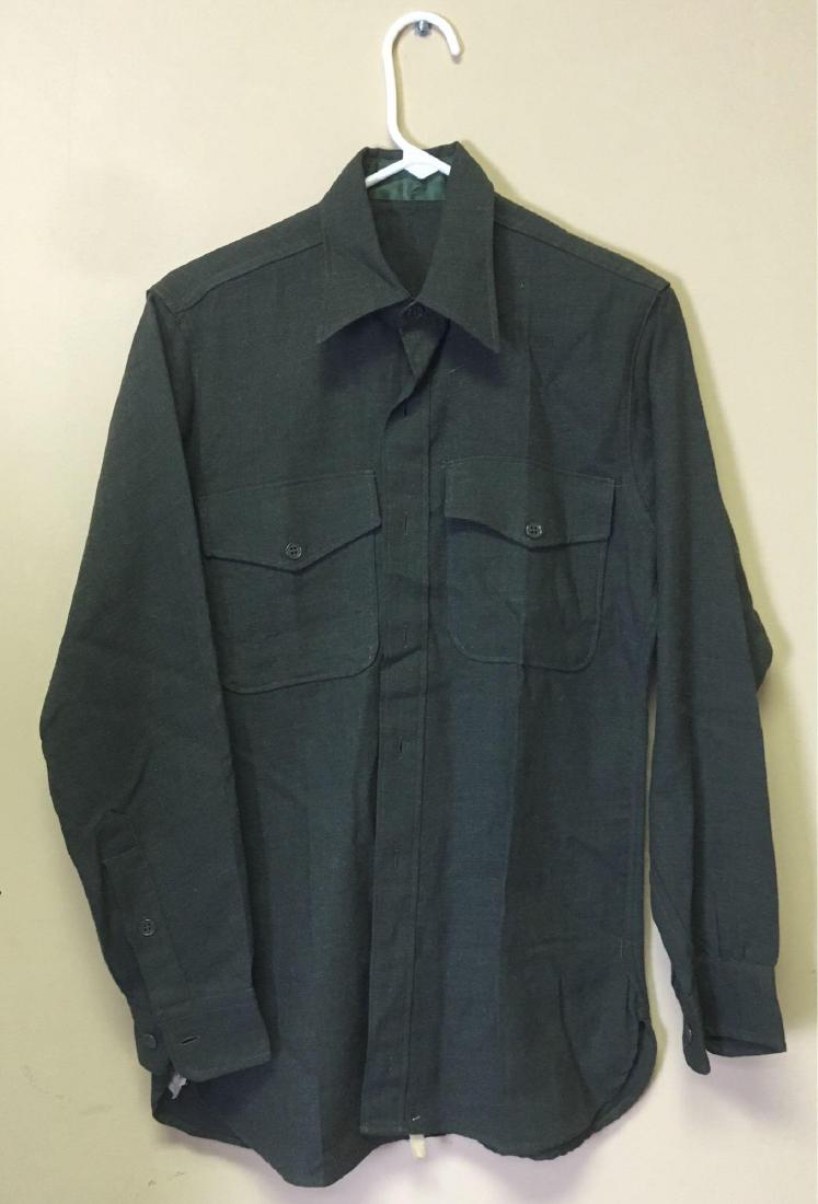 US Marine Corp Green Wool Dress Shirt Circa 1950's: US Marine Corp Korean War Green Wool Dress Shirt, Circa 1950's; this military shirt is in very good condition. The label shows "Publix Shirt Corporation, Cont Nom 63298, 18 June 1952". The shoulders m