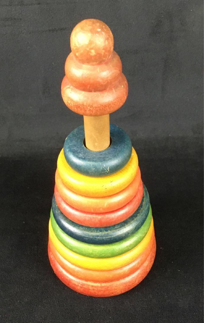 Vintage Holgate Wooden Stacking Ring Toy, Circa 1930's: Vintage Holgate Wooden Stacking Ring Toy, Circa 1930's; this stacking ring toy is in very good condition. It does show some wear from use over the years. The toy measures 8 1/2" H x 3 3/4" DIA.