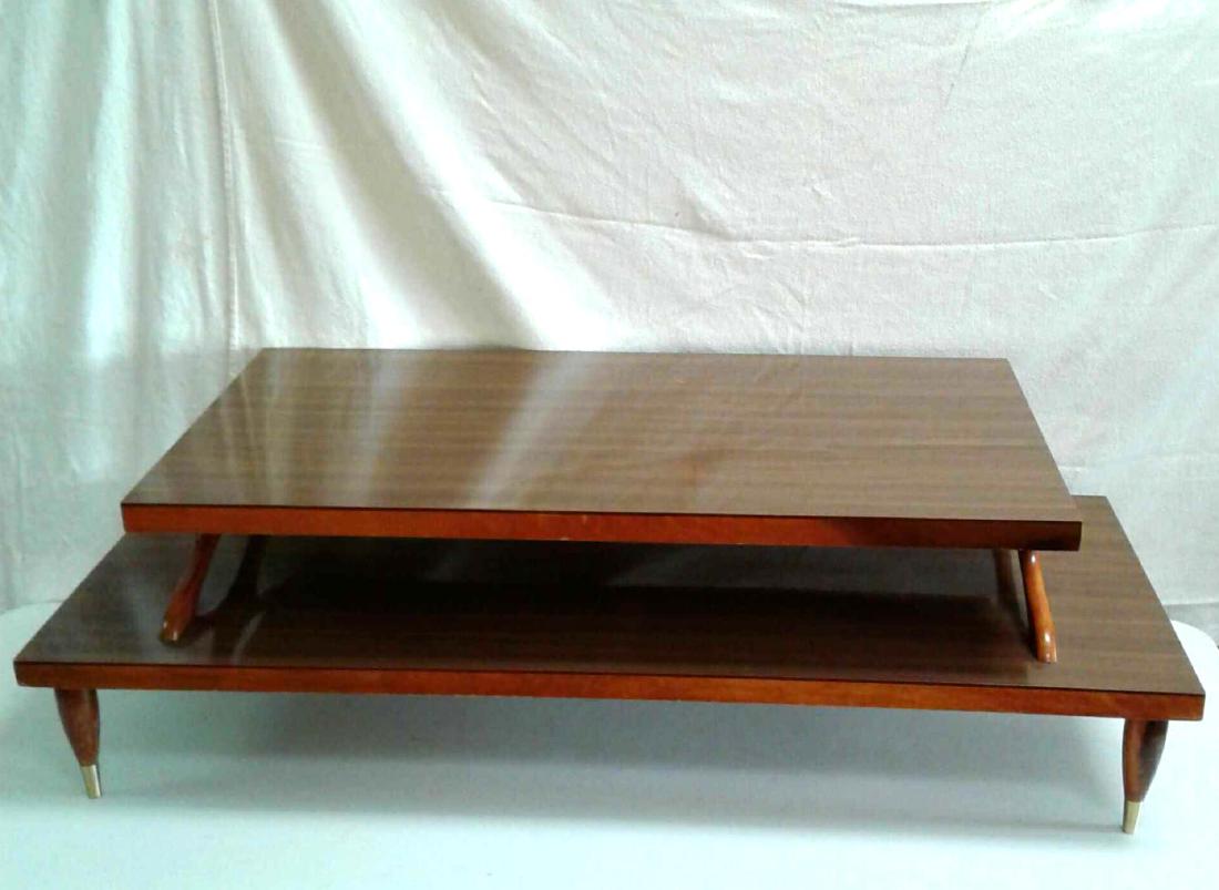 Mid Century Two-Tier Coffee Table: This Two-Tier Coffee Table is made with thick Veneer laminate wood grain tops, solid wood legs, and cross frame. The Veneer is in good condition with a coupleÂ of light scratches. The other wooden
