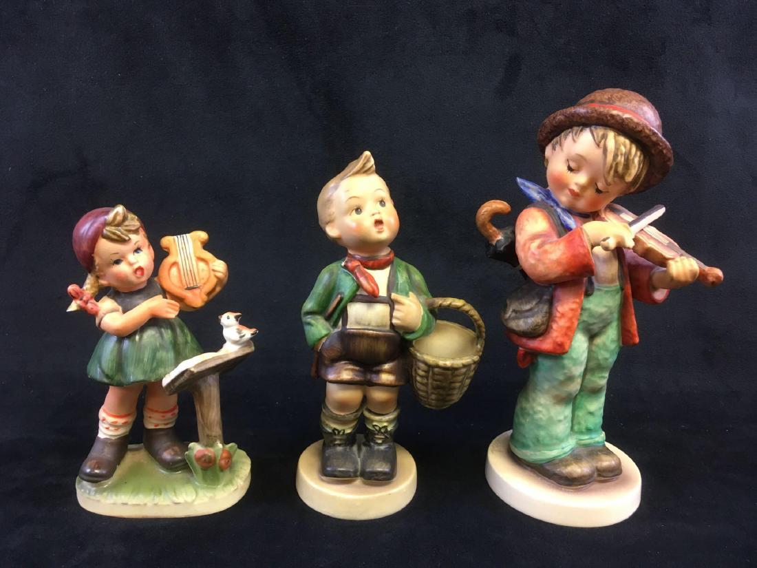 Lot of 3 Vintage Child Figurines, 2 Goebel Hummel 1: Lot of 3 Vintage Child Figurines, 2 Goebel Hummel, 1 Napcoware, All Marked; a nice collection of kids being rambunctous. Lot includes; 1) Hummel Little Fiddler, 2) Hummel Village Boy, both marked "W G