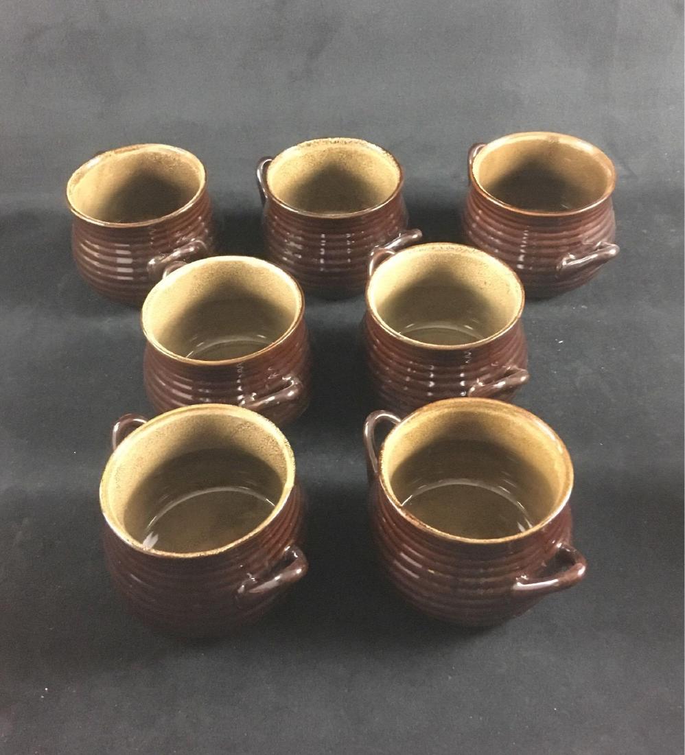 Lot of 7 Crate and Barrel Brunswick Soup Bowls, New Old: Lot of 7 Crate and Barrel Brunswick Soup Bowls, New Old Stock; these brown bowls show two handles and are in like new condition. They each measure 4 1/2" W x 6" D (w/handles) x 3 1/4" H.