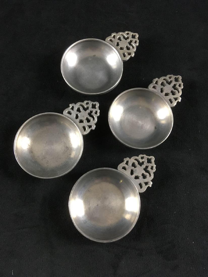 Set of 4 STEDE Small Pewter Porringer Bowls with: Set of 4 STEDE Small Pewter Porringer Bowls with Handles; all show the STEDE mark, and all are in very good condition. Each measures 2 1/2" W x 3 3/4" D (w/handle) x 1/2" H.Â