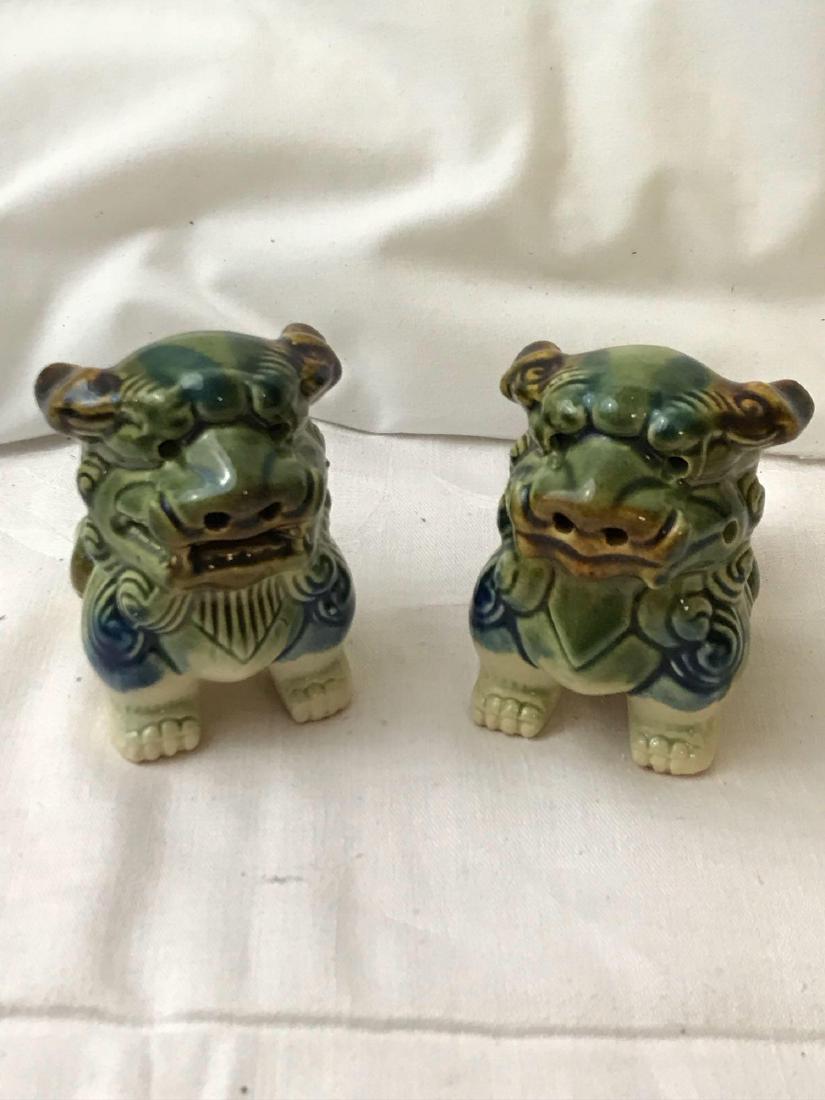 Vintage Pair Of Chinese Foo Dogs: Vintage porcelain Chinese Shi (foo dogs); each measures at approximately 3 3/4" H x 2" W.