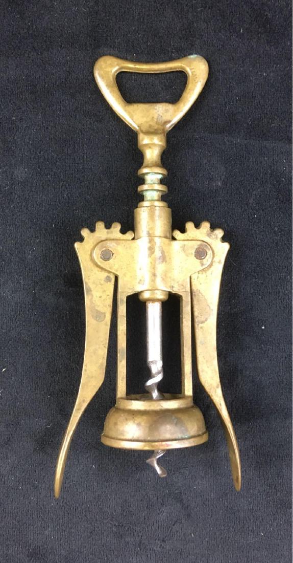 Vintage Brass Swing Arm Corkscrew Marked Italy: Vintage Brass Swing Arm Corkscrew, Italy; thisÂ corkscrew is in very good condition, it shows great patina. The action is very smooth. The tool measures 2 1/2" W x 7" L.