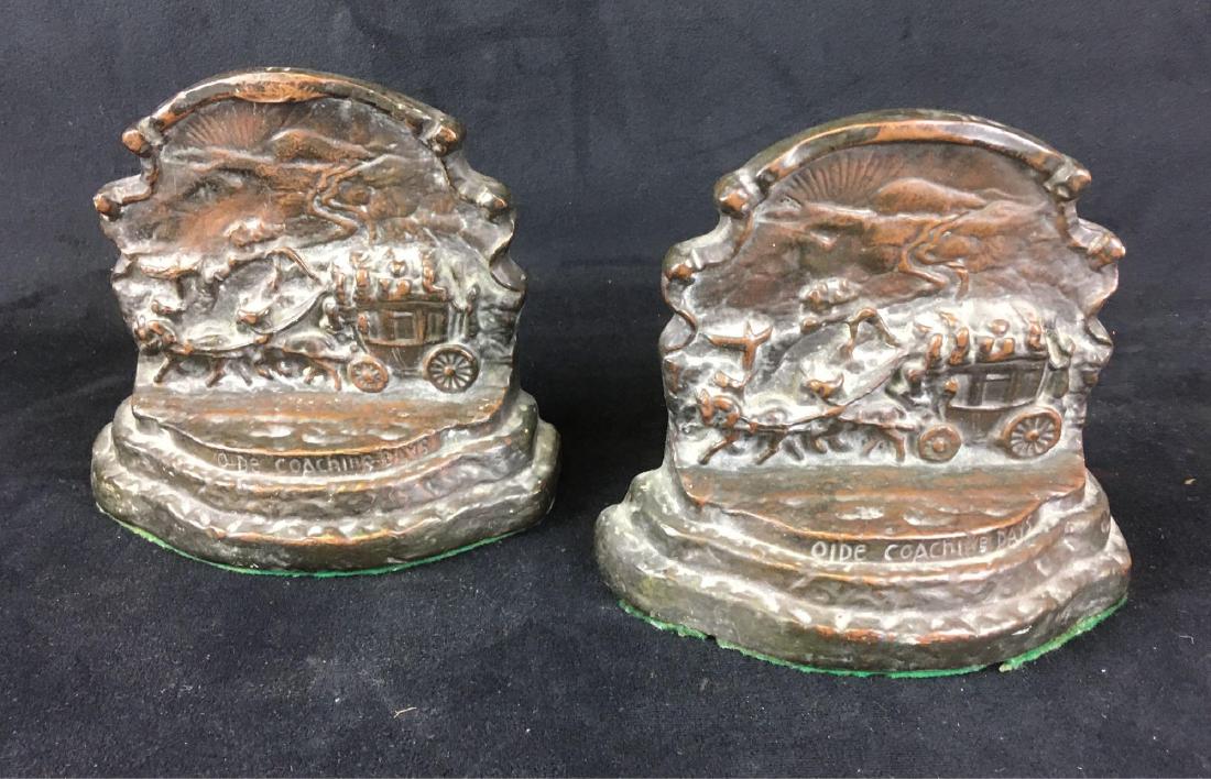 Vintage Filled Bronze Bookends: Vintage Filled Bronze Bookends; showing a scene title "OldeÂ Coaching Days", these show much texture and detail. They are in good condition with the only issue noted is a heavy layer soiling from st