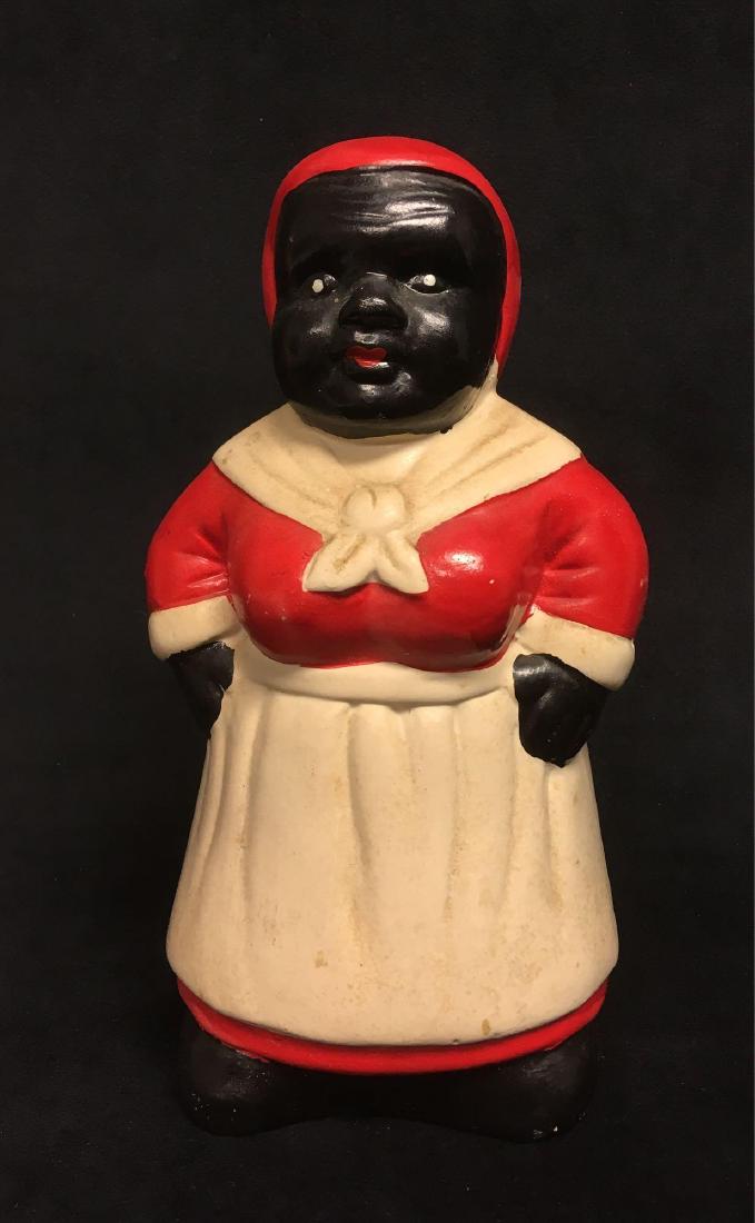 Black Americana Ceramic Aunt Jemima Mammy Bank: Black Americana Ceramic Mammy Bank; this coin bank is in good condition, it shows a a layer of soiling om a matte glazed finish. There are no chips or cracks noted. It is marked "Made in China" on the