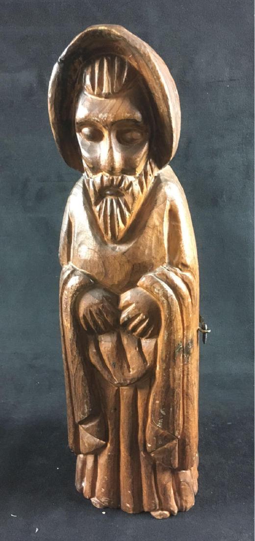 Spanish Hand Carved Wood Maester Wine Holder Monk: An oddity from Spain, vintage wooden wine cabinet in the shape of a maesterÂ (religious book keeper). Based on the hardware, we estimate it to have been made in the 1970's. It stands 15" high and is