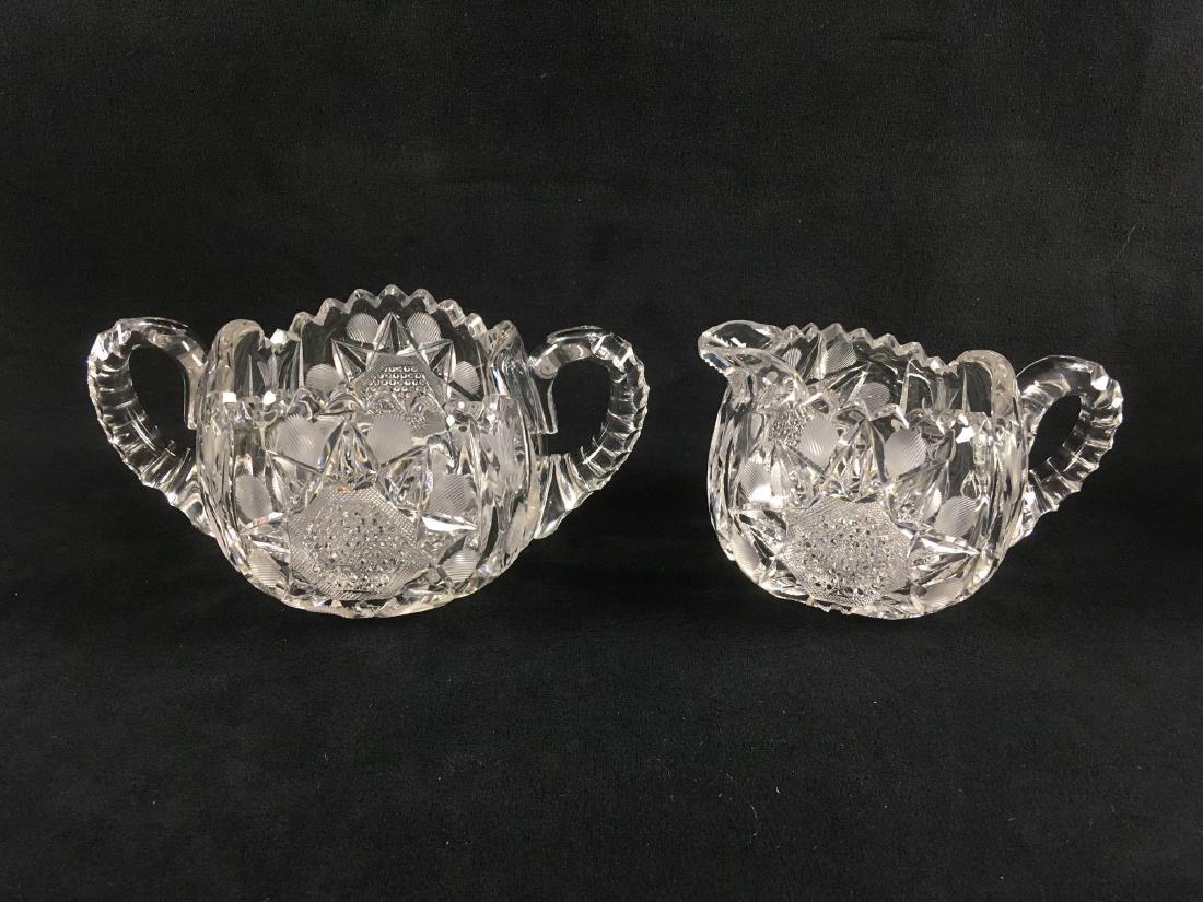 Vintage Clear Cut Crystal Creamer and Sugar Set: Vintage Clear Cut Crystal Creamer and Sugar Set; a nice set of vintage European style. These pieces are not marked but are very substantial showingÂ much design. Both pieces show the sawtooth rim po