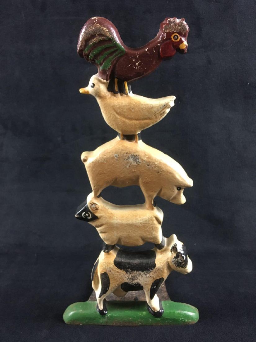 Vintage Painted Farm Animal Cast Iron Door Stop: Vintage Painted Farm Animal Cast Iron Door Stop; a nice piece that would make Old MacDonald jealous. This little stack of livestock is in good condition. It is noted the Holstein milk cow shows some s