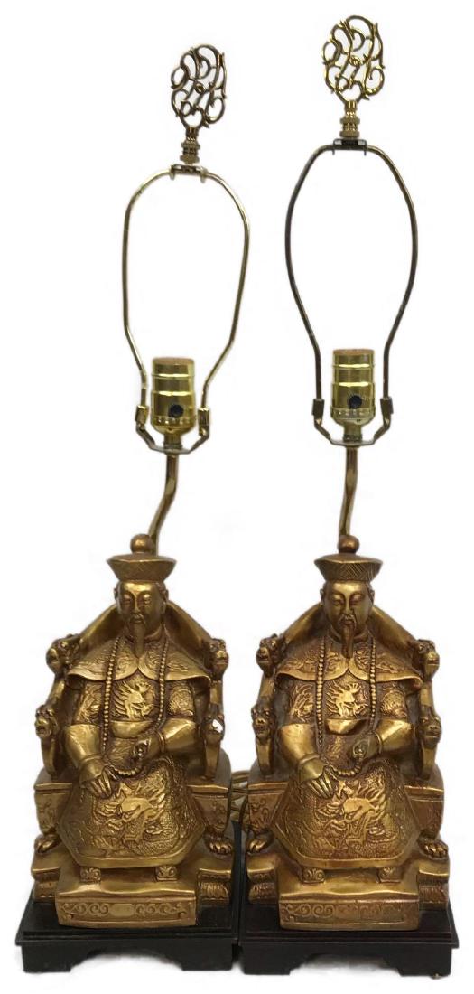 Pair of Sitting Confucius Table Lamps: Â Pair of Sitting Confucius Table Lamps; a pair of lamps with harps and finials. These lamps show a wise man sitting on rich chair in Chinese style. Each shows markings on the base. They are ornatel