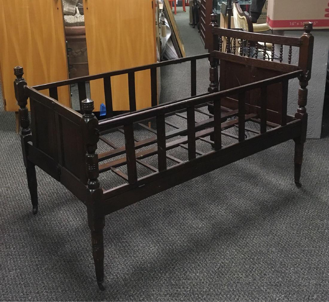 Antique Oak Folding Crib: Antique Oak Folding Crib; this piece appears to have held more than a few small children through the years. It operates as designed, it is in good condition. The crib shows several replaced fastenings