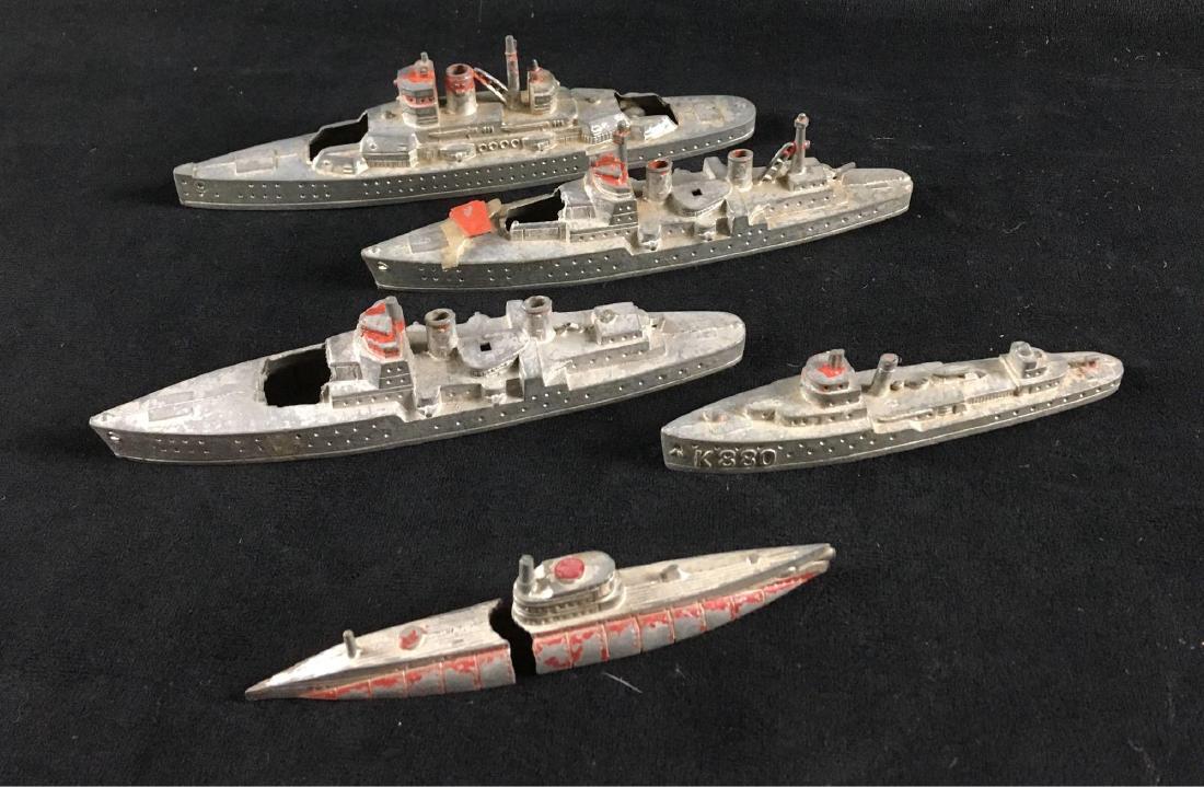 Vintage Tootsie Toy Fleet of 5 Diecast Ships: Vintage Tootsie Toy Fleet of 5 Diecast Ships; every vessel of the fleet is marked. Four ships of the fleet are in fair condition as they are missing their big guns. The one submarine appears to have h