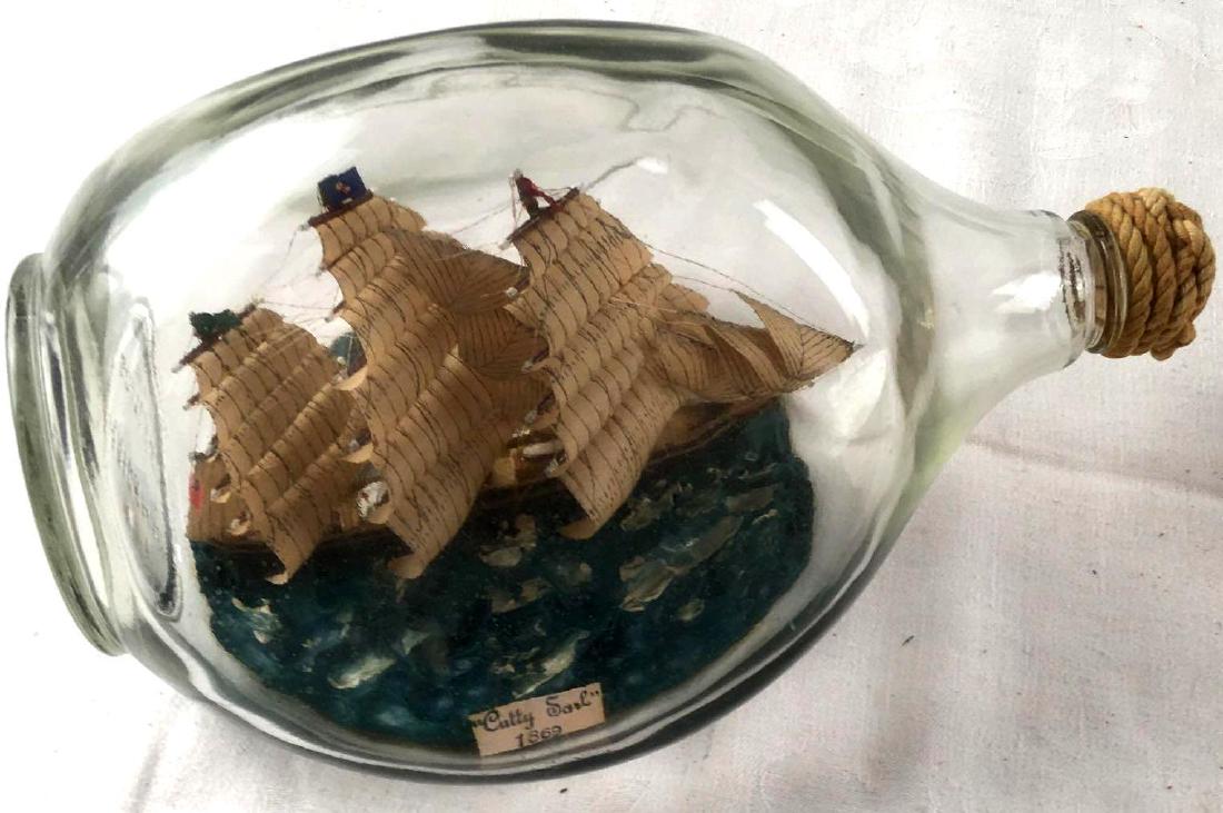 Vintage "Cutty Sark" Ship In Bottle: Vintage "Cutty Sark" Ship In Bottle; Great replica of the famous Cutty Sark ship that was built in 1869 and was one of the last tea clippers to be built and also one of the fastest. The bot