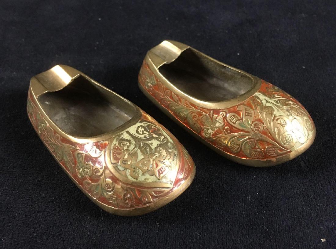 Vintage Brass Slipper Ashtray Lot: Brass red slippers pair of ashtrays, circa 1960's or 70's, likely made in India. The slippers have an Indian or Eastern theme. 3.1/4" L, 1.1/4" W, .3/4" H