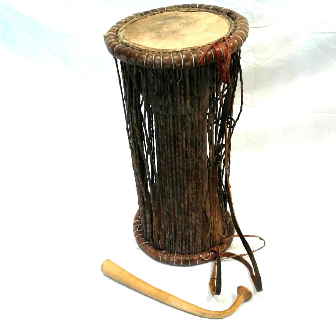 Original African Yoruba Talking Drum: Rare Vintage Tribal Drum and Hand Carved Stick; rare tribal double sided drum made in the West African style (gangan or bata of the Yoruba People?). It has a carved hour glass figure, one cone is