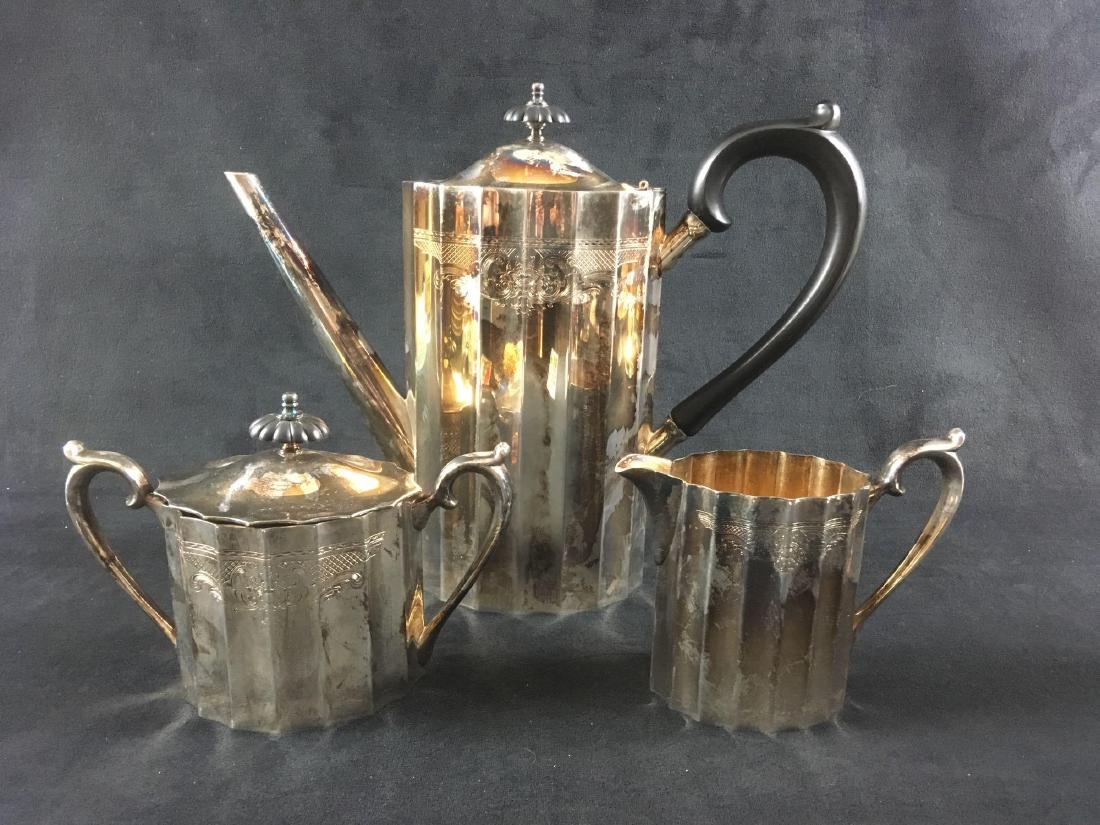 Vintage Lunt Silver Plate 3 Piece Coffee Set in: Vintage Lunt Silver Plate, 3 Piece Coffee Set, Colonial Classic Pattern; all pieces are marked. The bottom of the creamer shows the added engraving "VGR" and "Holy Angels Parish 6-23-074". All pi