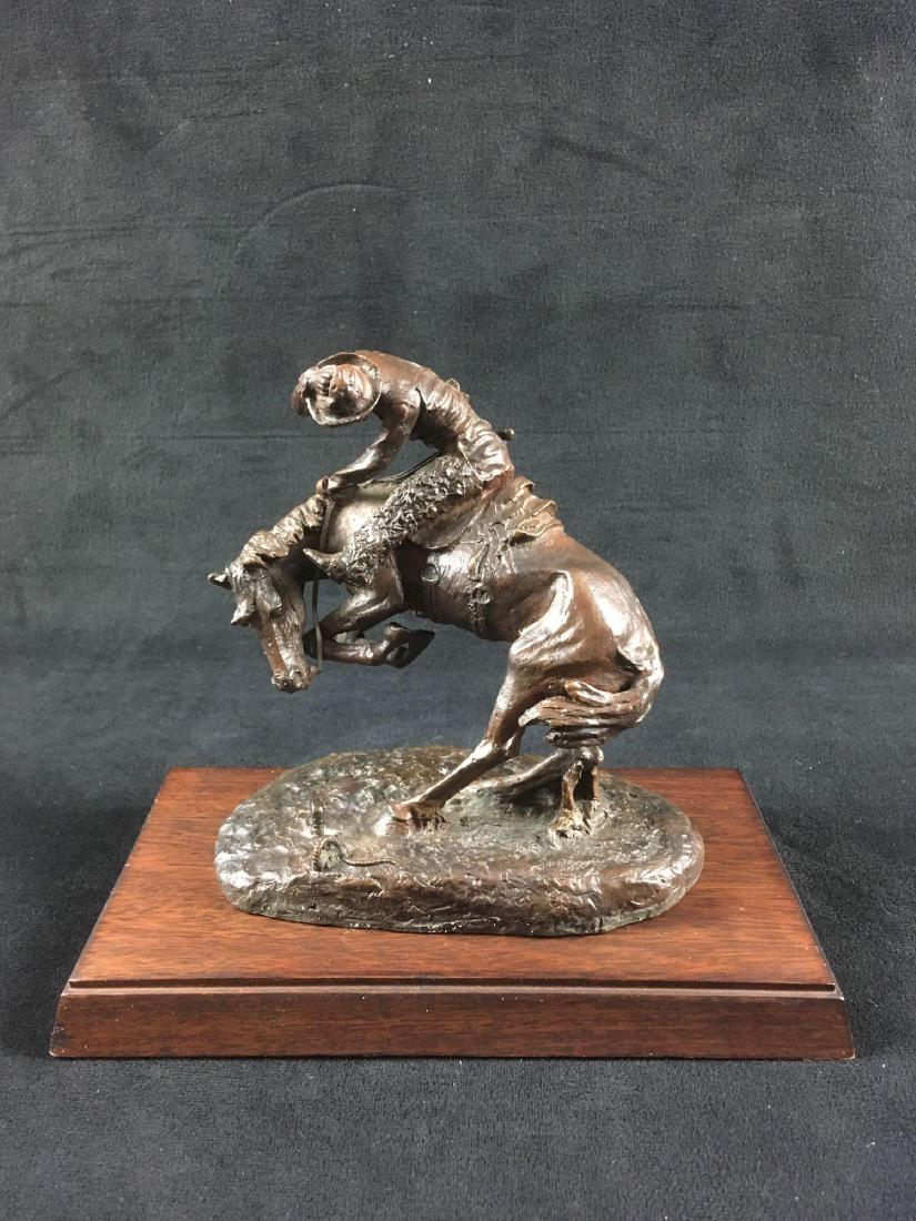 Frederic Remington Bronze Sculpture The RattlesnakeÂ by: Frederic Remington Bronze Sculpture, The RattlesnakeÂ by The Franklin Mint, in Original Packaging; this intriguing piece is marked as an "Official Issue of the Frederic Remington Art Museum", and ca