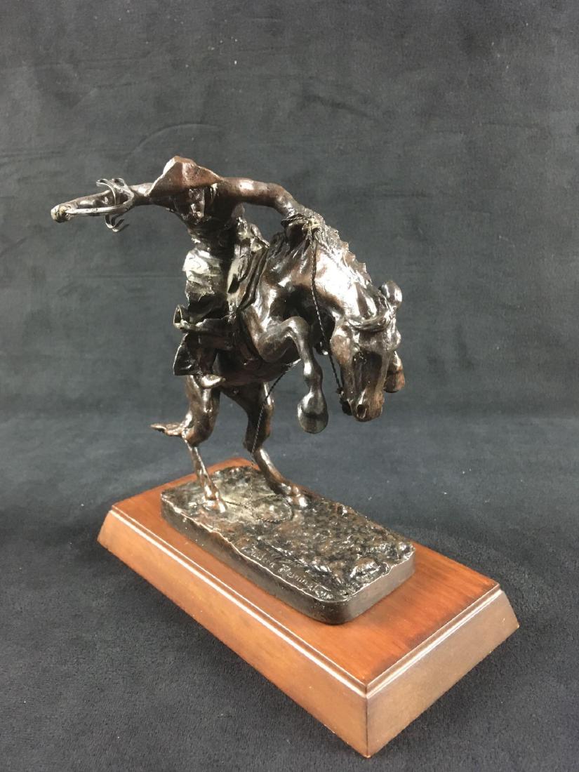Frederic Remington Famous Bronze Sculpture The Bronco: Frederic Remington Famous Bronze Sculpture, The Bronco Buster by The Franklin Mint, in Original Packaging; this stunning piece is marked as an "Official Issue of the Frederic Remington Art Museum", an