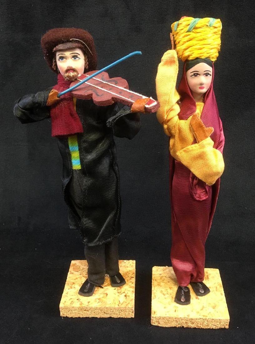 Set of 2 Handmade Israeli Dolls: Set of 2 Handmade Israeli Dolls. The two dolls are in good condition. They have been enclosed in original plastic packaging and show hardly any signs of age or wear. One doll is a violin playing man a